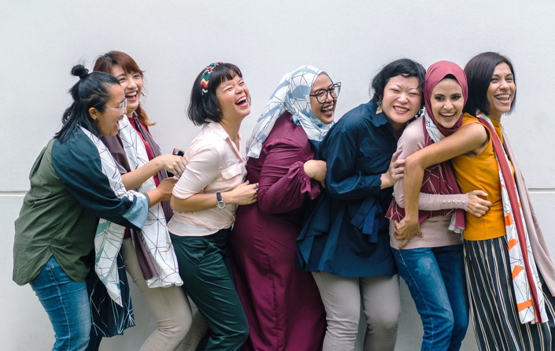 Women hugging each other and happy